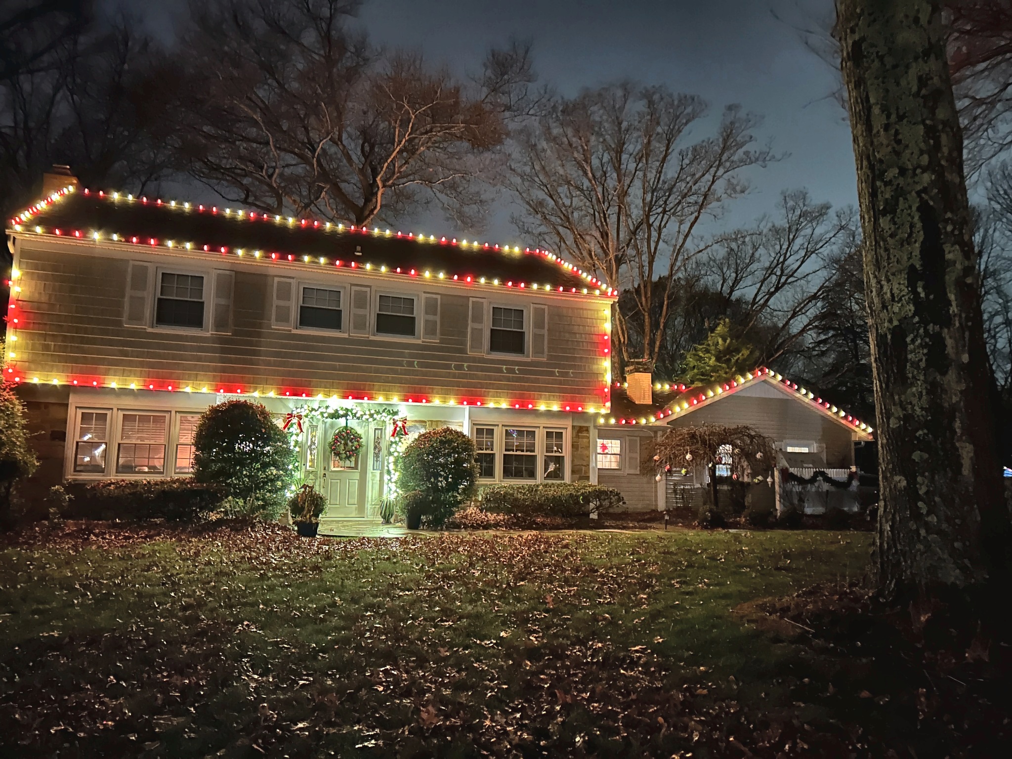 Festive red and white roofline Christmas lighting