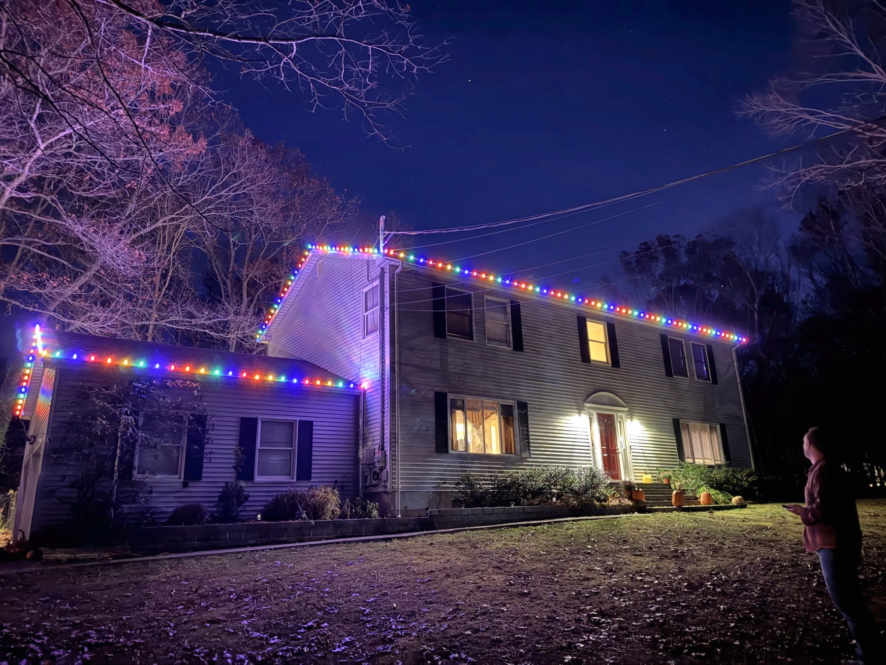 Christmas Illuminations LI holiday lighting installation: Colorful Roofline Celebration