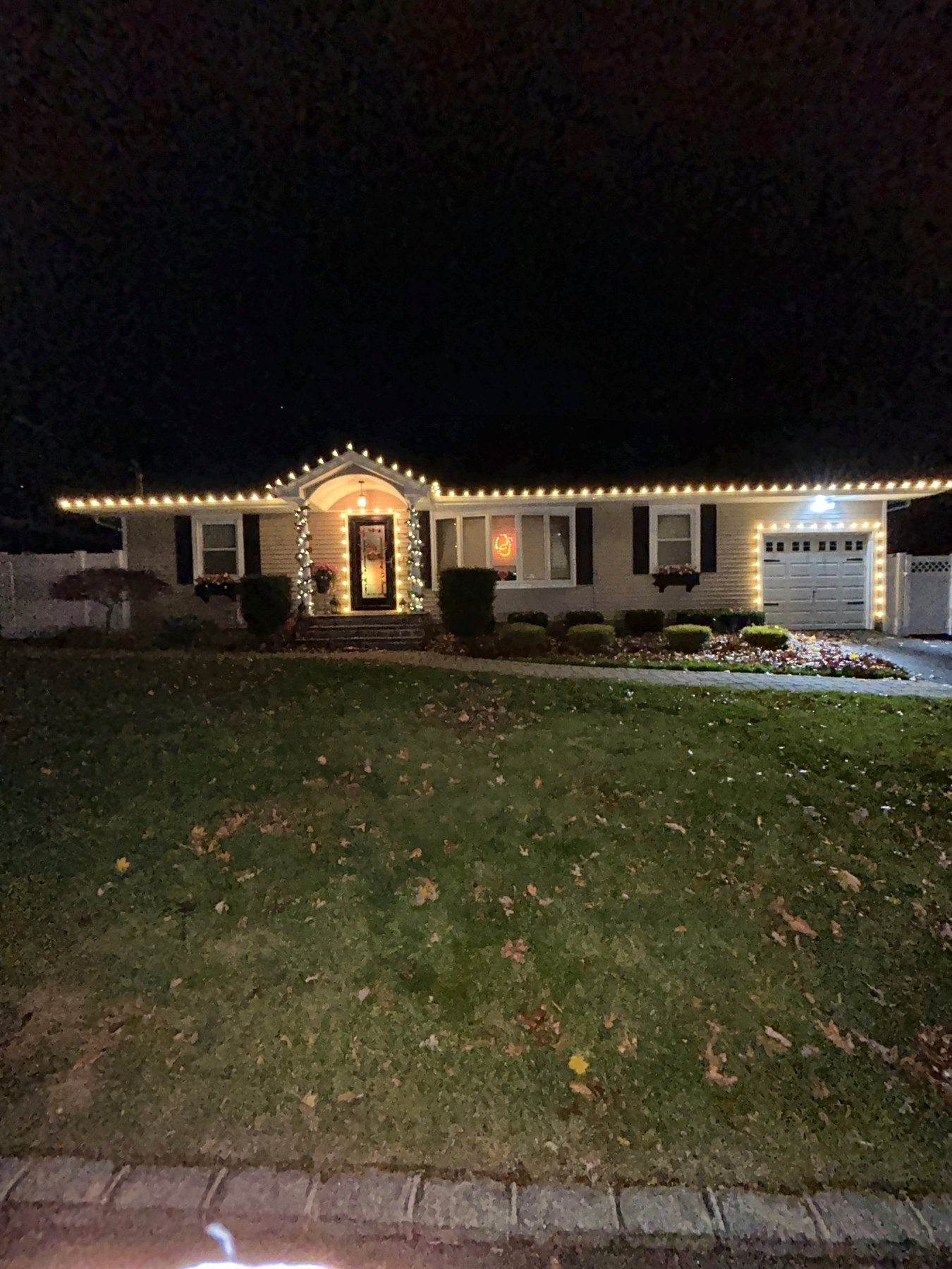 Christmas Illuminations LI holiday lighting installation: Classic Roofline at Dusk